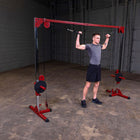 Man using a cable machine in a gym setting