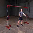 Man using a cable machine in a gym setting