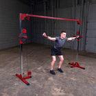 Man using a cable machine in a gym setting