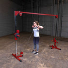 Person using Best Fitness BFCCO10 Cable Crossover in a gym setting