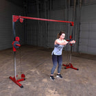 Woman using a cable machine in a gym setting