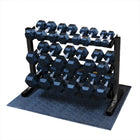 Set of dumbbells on a black metal rack with a blue mat underneath.