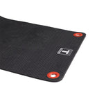 Black mat with red grommets and a logo on a white background