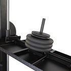 Stack of weight plates on a weightlifting machine with a white background