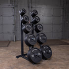 Set of dumbbells on a rack in a gym setting