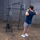 Person using a cable machine in a home gym setting