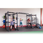 People exercising with weightlifting equipment in a gym.